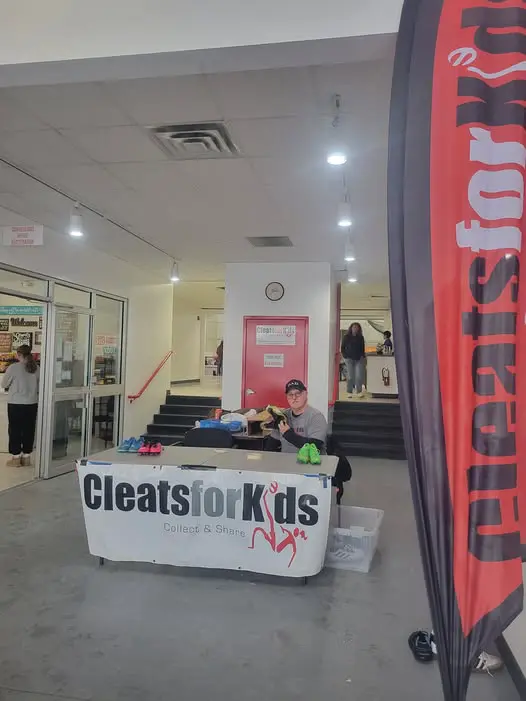 Cleats for Kids collection table at Soccer Stop