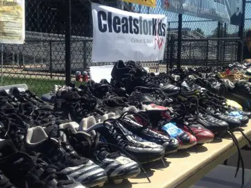 Display of donated soccer cleats at outdoor event